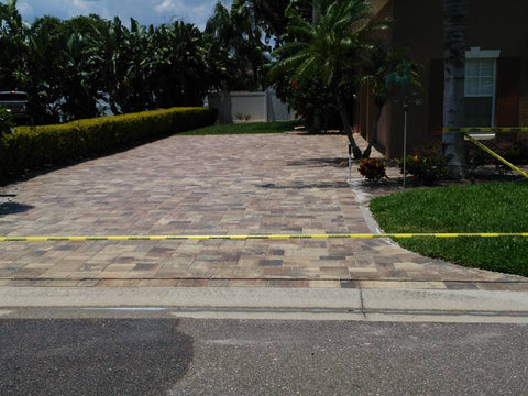 Use caution tape to protect a newly sealed driveway
