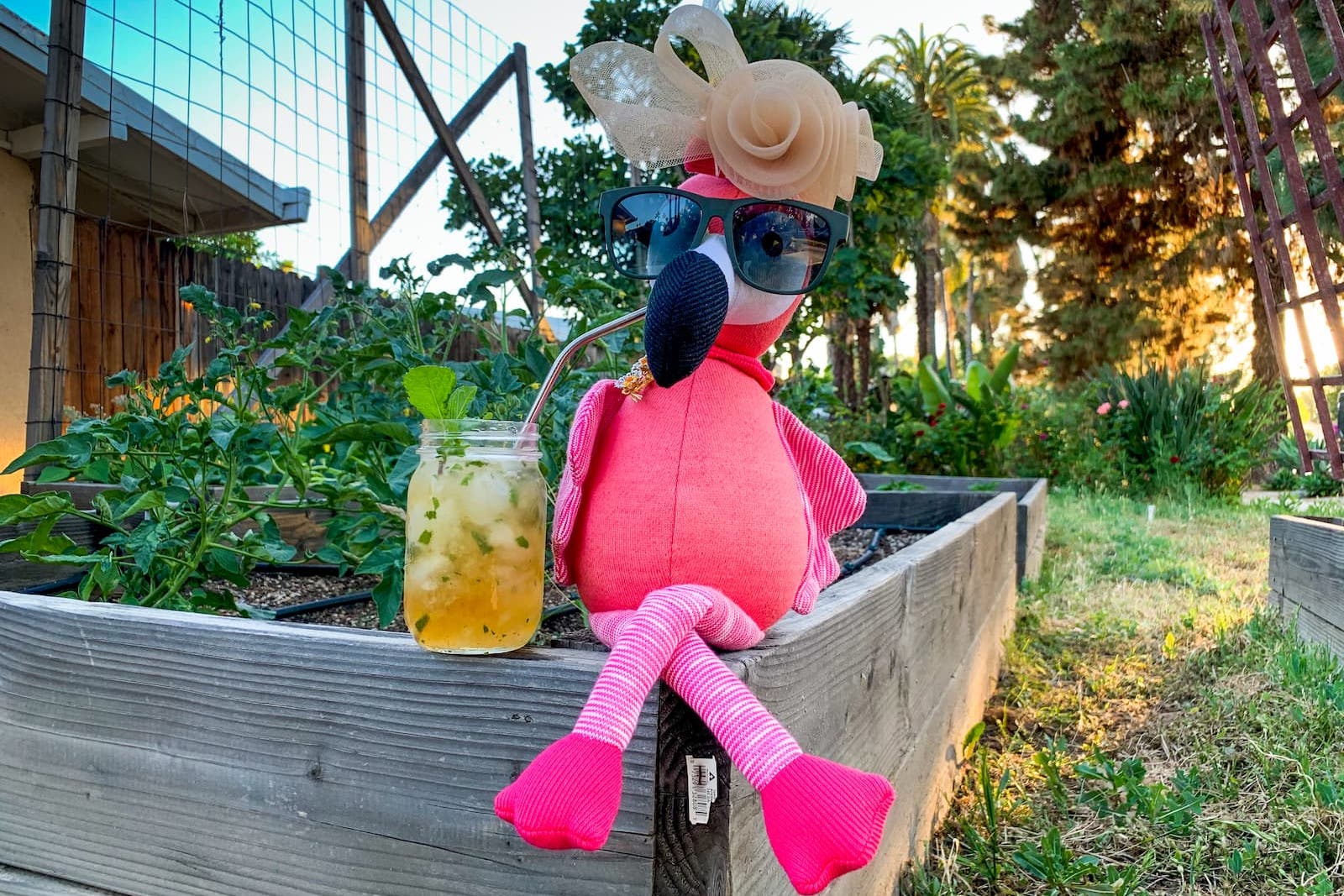 Carl the Flamingo CEO at the Kentucky Derby drinking mint juleps