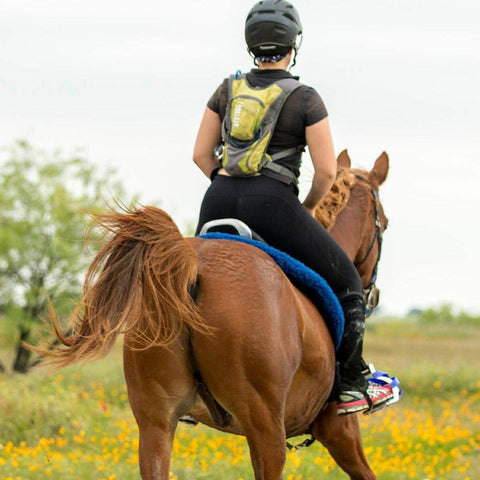 Devan Horn wearing a Nathan VaporHowe 2 Liter and Camelbak Charge while riding.