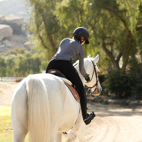 Helen Pollock from Life Equestrian using a CWD Mademoiselle Saddle while riding a horse.