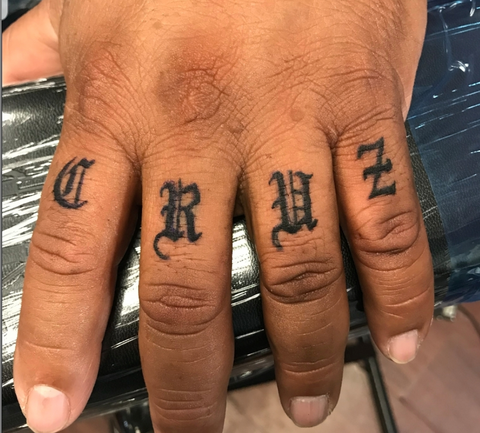 Script Finger Knuckle Tattoos