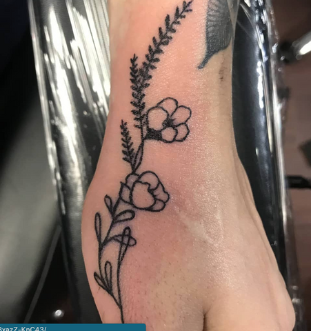 Flowers Side Of Hand Tattoo