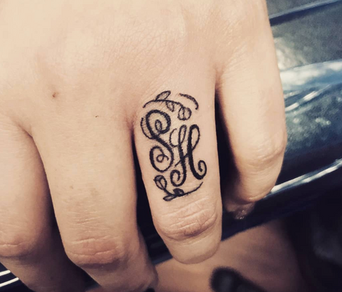 Script Finger Tattoo