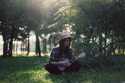 Soprano ukulele girl in forest