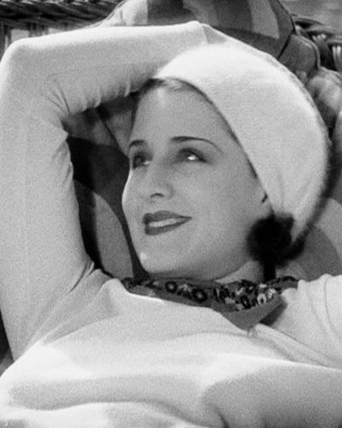 Image of Norma Shearer with head scarf