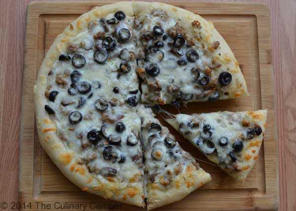 round pizza with olives and cheese