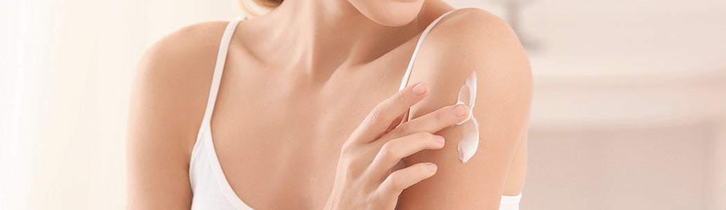 Person Using CBD Anti-blemish Cream on Their Shoulder