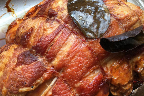 Roast turkey breast wrapped in bacon, just out of the oven.