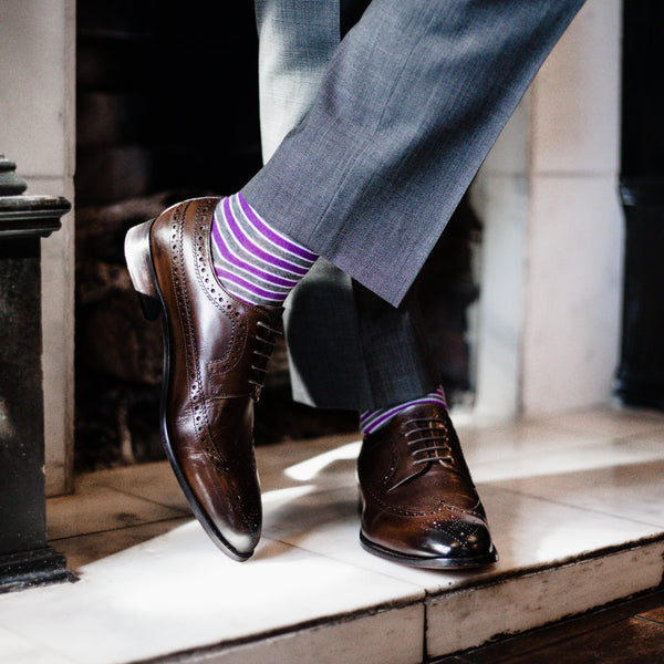 Man with Purple,White, and Grey Socks