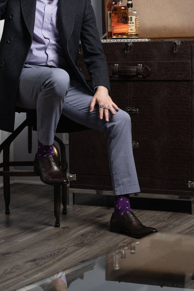 Guy wearing purple dress socks