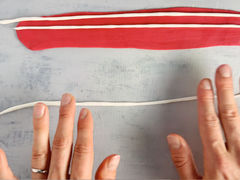 Roll more white fondant to make American flag stripes