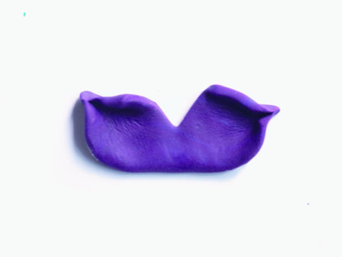 Fondant oval pinched to make a tail