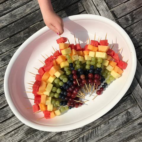 Fruit skewers made into a rainbow