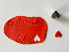 Fondant hearts cut out for Valentine's day cake decoration