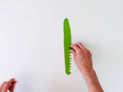 Use the triangle cutter to cut blades of grass out of green fondant