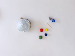 Ingredients and equipment to decorate a golf themed mini cake with fondant