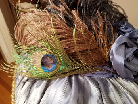 feathers attached to hat with hand stitching
