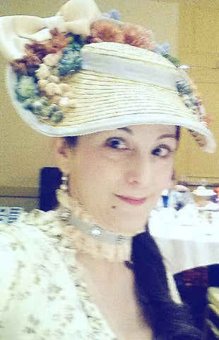 Wearing the decorated bergere hat.