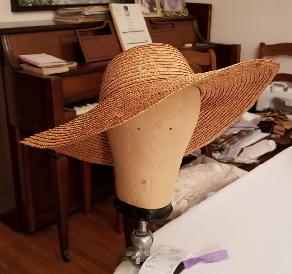 steaming hat into shape