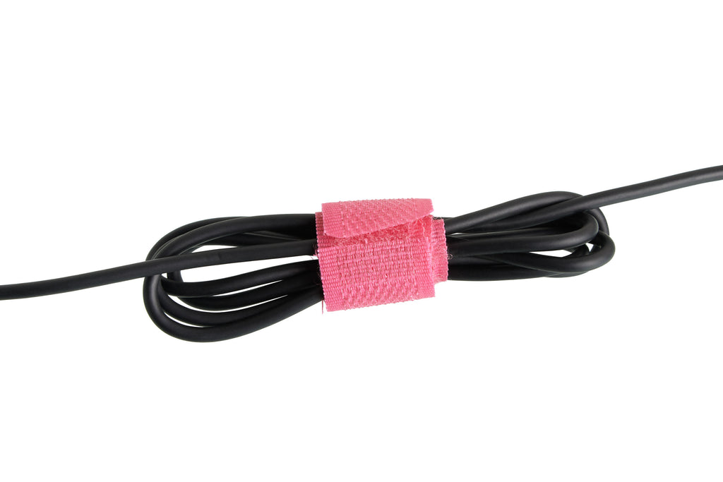 Black cord tied with pink velcro tie isolated on white background