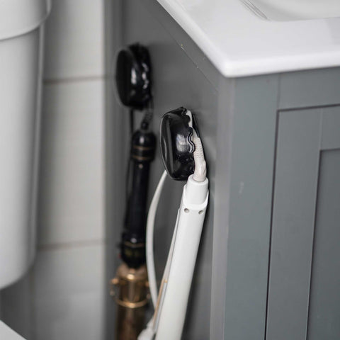 grey bathroom cabinet white counter top hair appliances
