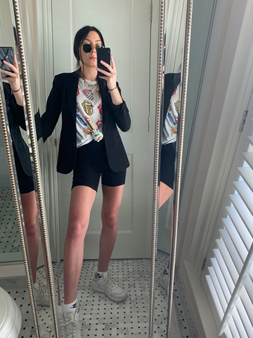 Black blazer styled for sporty chic