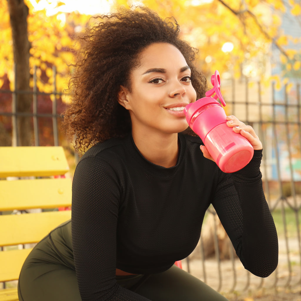 woman drinking vegan protein powder