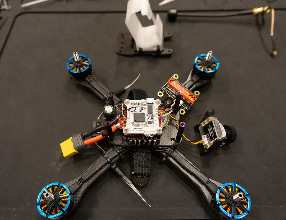 Installed motors, ESC, and FC with Vtx connected and FPV Camera