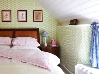 sussex cottage bedroom decorated in molly mahon wallpaper leaf grass design with bespoke molly mahon bed linen