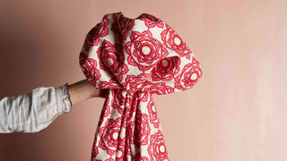 The beautiful Rose hand block printed fabric design being displayed in a studio for a photoshoot