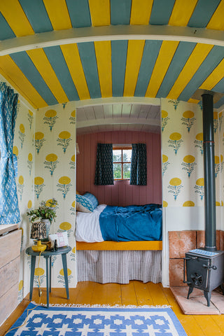 Shepherd hut interior designed with Molly Mahon fabric and wallpaper creating an inspiring uplifting space full of colour and joy