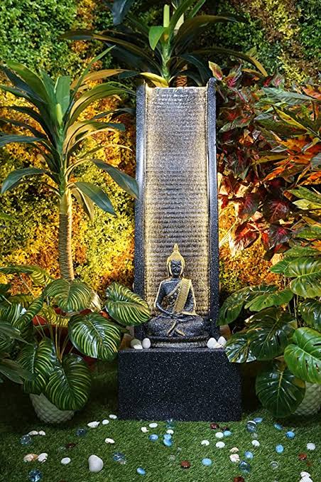 gautam buddha statue in water