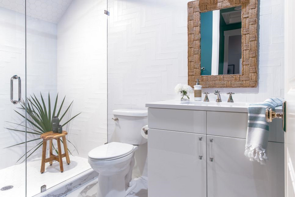 All White Bathroom With Barnwood Style Mirror