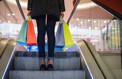 an image of a shopper with multiple bags