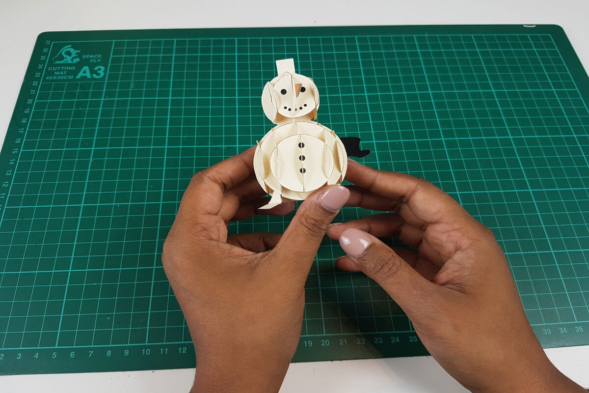 How To Make a 3D Christmas Pop Up Card - picture of the face of the snowman completed