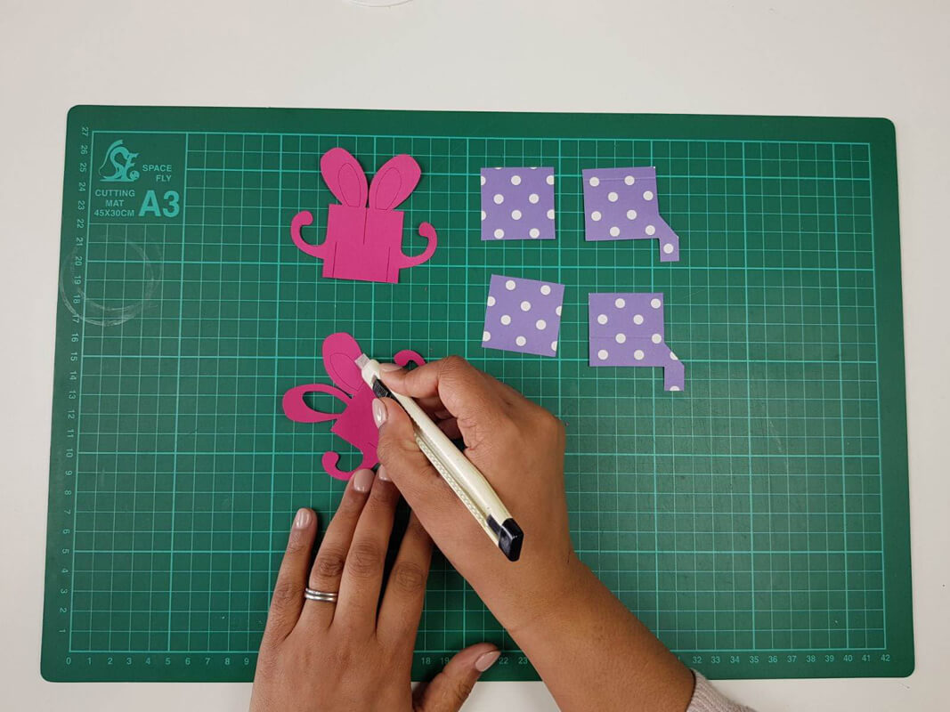 how to make a birthday pop up card tutorial - picture showing the pieces being cut out with a craft knife
