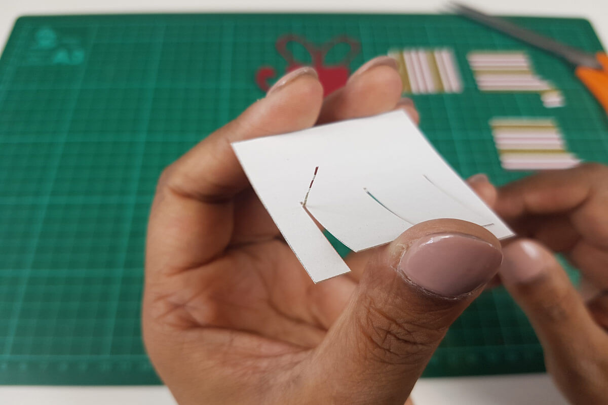 How To Make A Christmas Pop Up Card Tutorial - picture of cutting the slots in the card slices