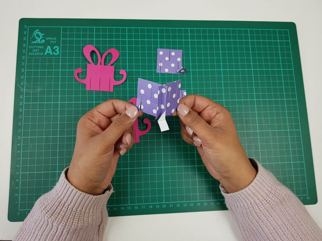 how to make a birthday pop up card tutorial - picture showing slotting the pieces together