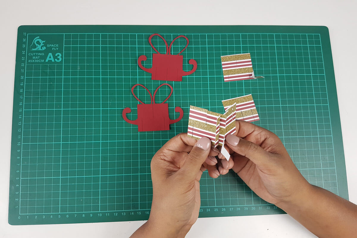 How To Make A Christmas Pop Up Card Tutorial - picture of slotting the first 2 slices together