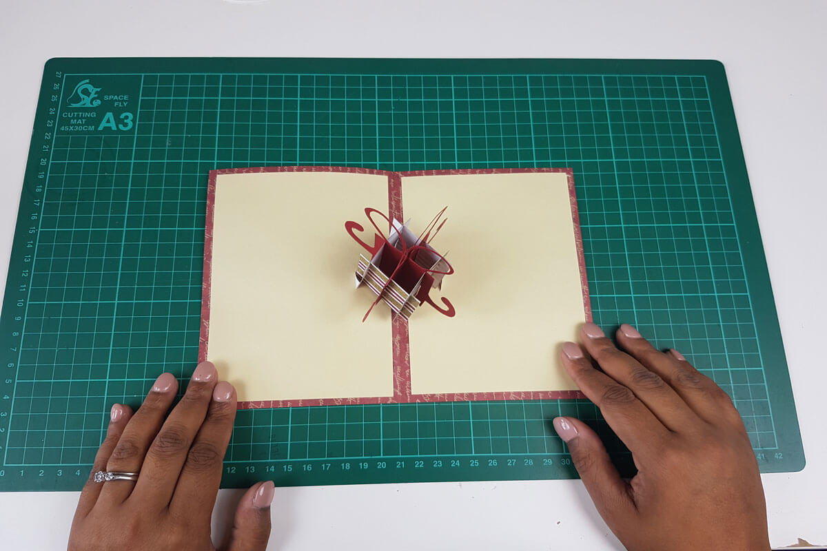 How To Make A Christmas Pop Up Card Tutorial - picture of sticking the inner cover to the outer cover