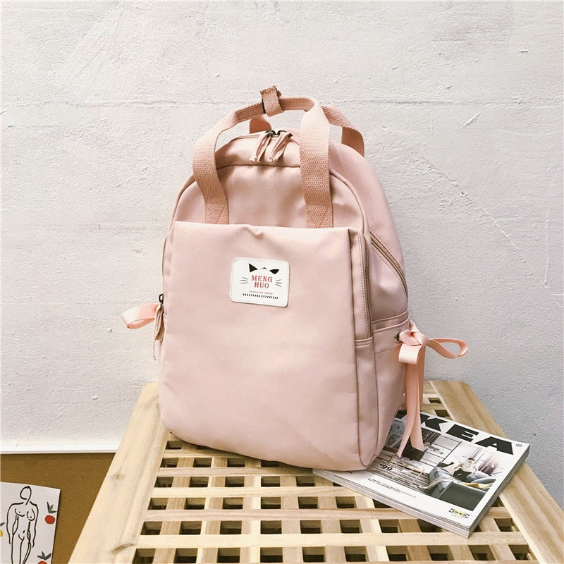 small pink rucksack