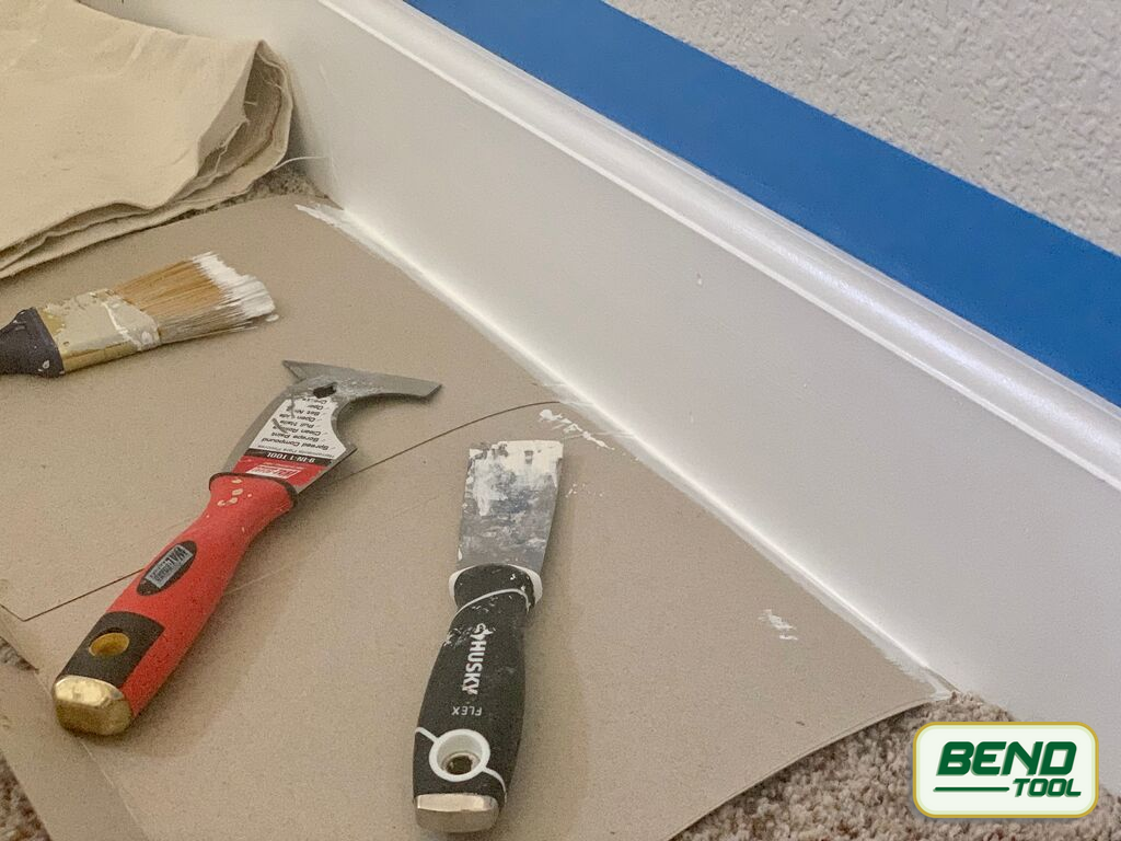How to paint baseboards with carpet - putty knife, all in one tool to help remove painters tape and carpet protection
