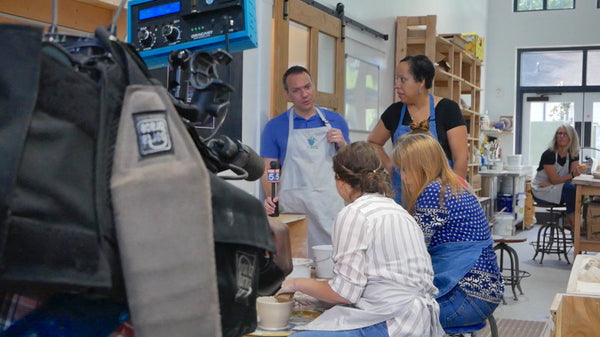 Hannah clay pottery instructor giving tips to one of the members live on Good Day Atlanta