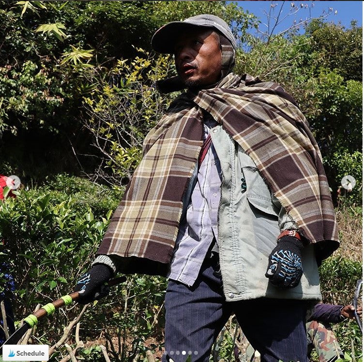 A Khasi man wearing a Tartan scarf | Muezart