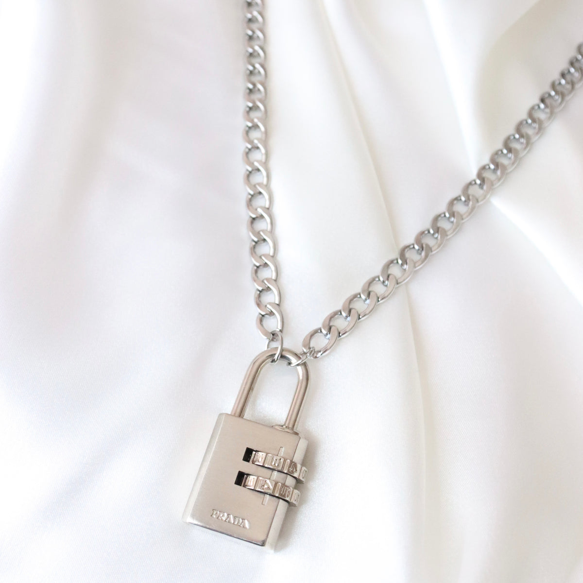 reworked prada lock necklace