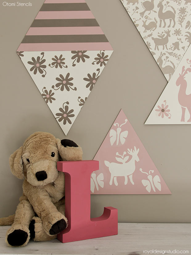 DIY Nursery Wall Decor: Adorable Otomi Stenciled Wood Shapes - Learn how to create DIY sweet nursery wall in Neopolitan ice cream shades using Chalk Paint® by Annie Sloan, Otomi Stencils, and Triangle Wall Art Wood Shapes from Royal Design Studio.