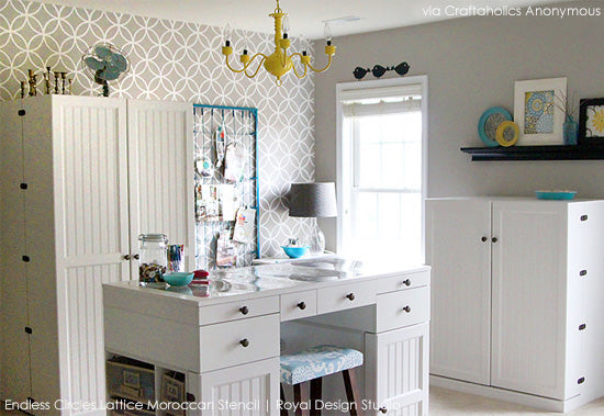 Amazing craft room space with stenciled walls and tons of storage