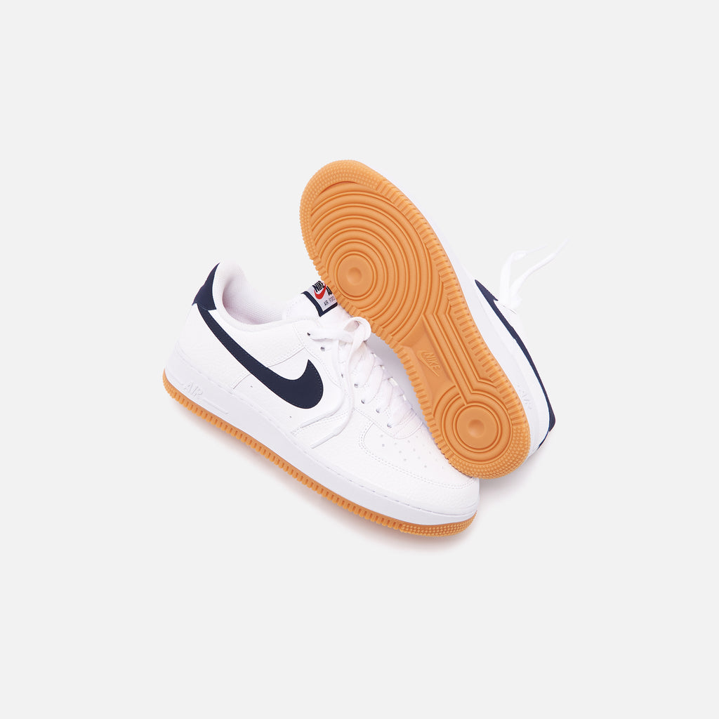 nike air force 1 sneakers with navy swoosh and gum sole