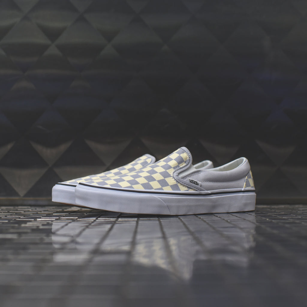 grey and white checkerboard slip on vans