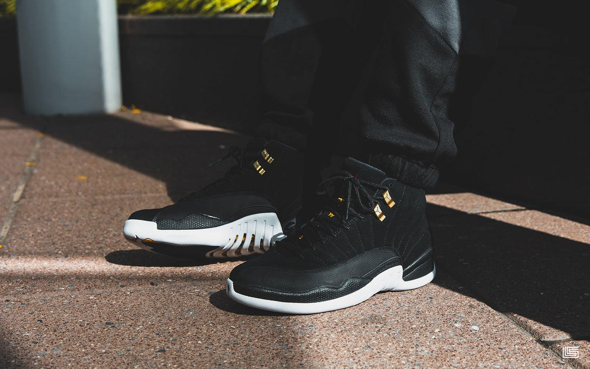 black jordan 12 reverse taxi